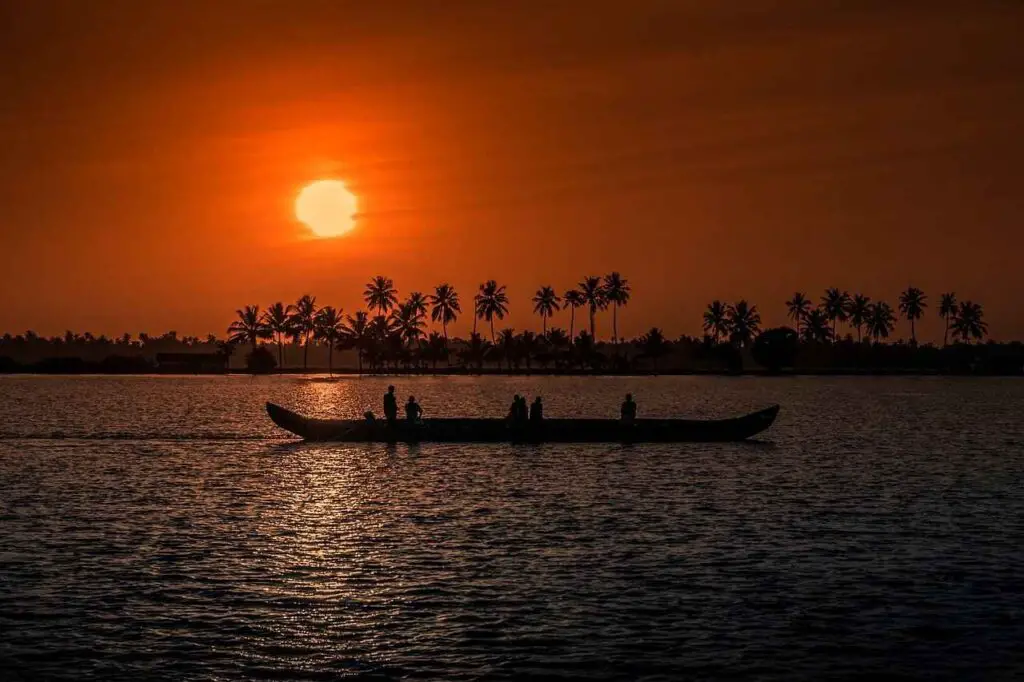 Sunset view of a boat in lake in Kerala